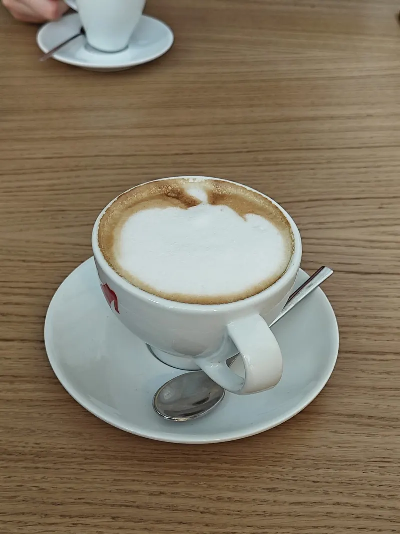 A cappuccino on a wooden table