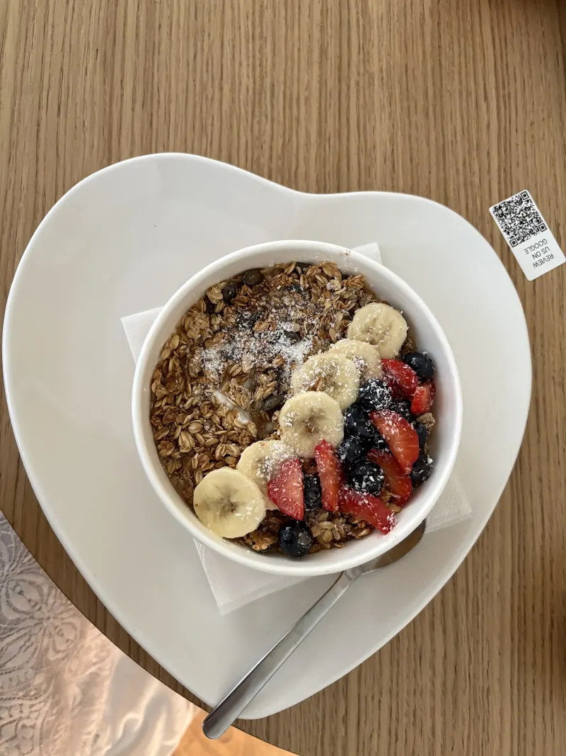 Granola bowl with yogurt, banana and fresh berries